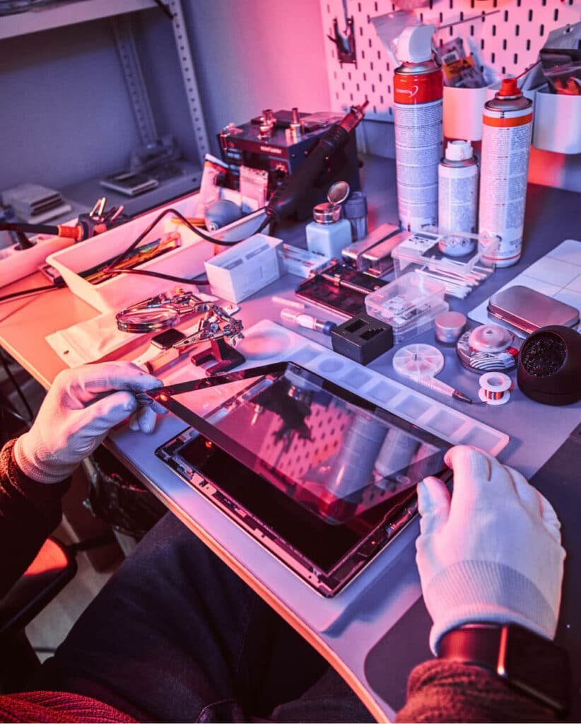 Printer Setup and Repair St Albans technician servicing a device on a workbench