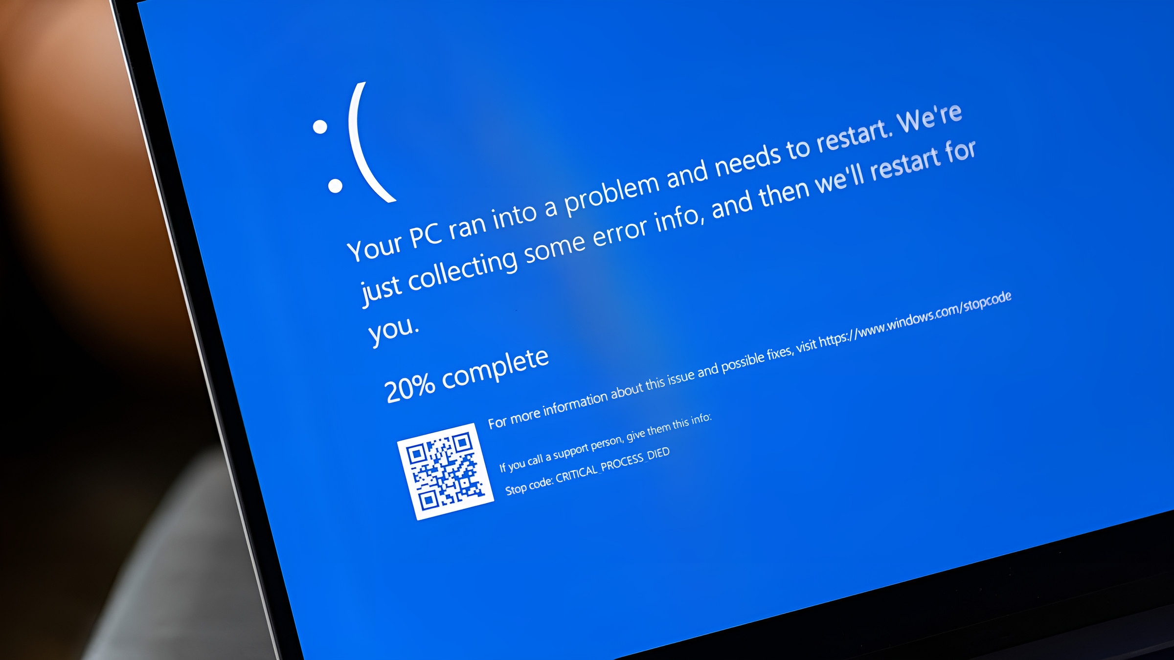 A laptop showing a Windows blue screen error
